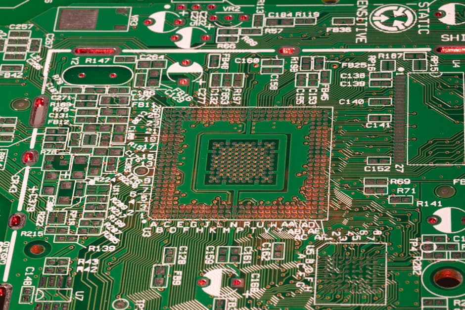 Detailed view of a green printed circuit board with visible components and connections.