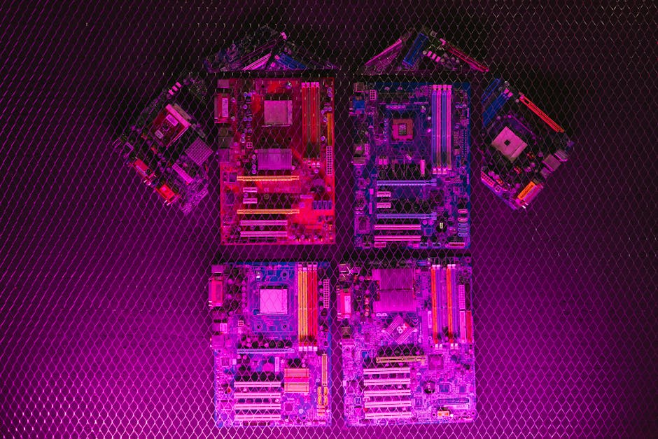 Creative arrangement of circuit boards with neon lighting, highlighting modern technology aesthetics.